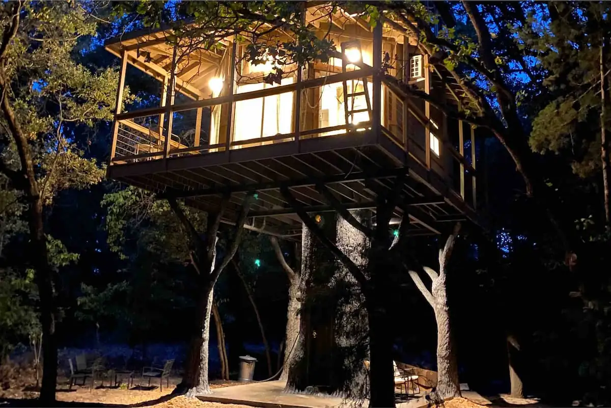 Moon Honey at night, the veranda and catwalk lit up